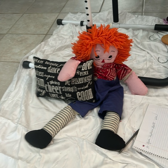 Raggedy Andy or raggedy and I’m not sure and a cute little cheerful pillow - Picture 1 of 1